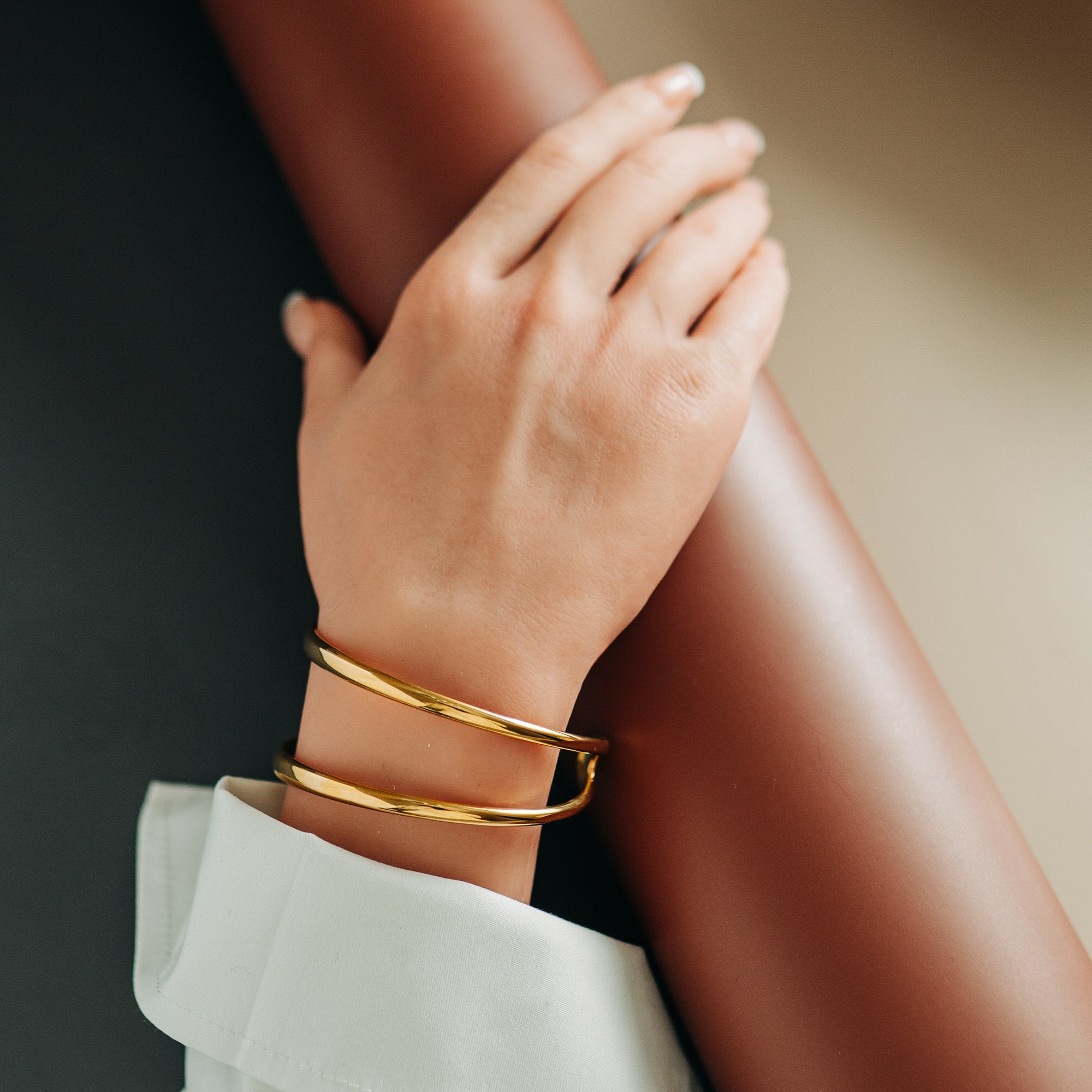 Justerbar dubbelarmring